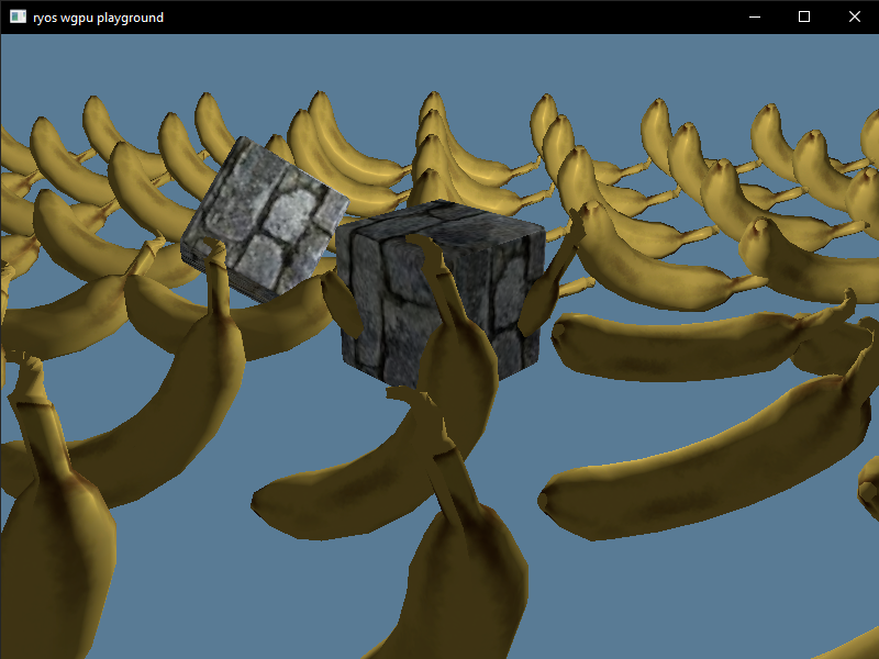 Screenshot of the native wgpu Rust app rendering a grid of 3D bananas and 2 cubes in different positions
